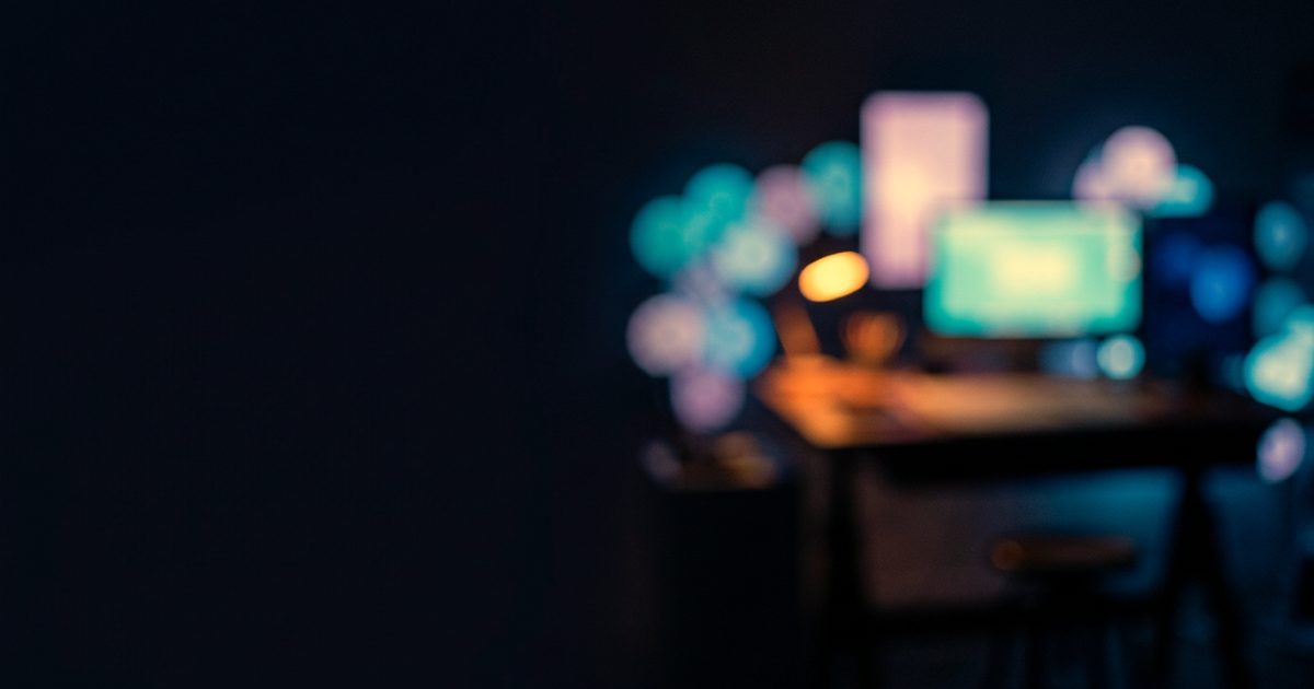 A design studio desk glowing softly at night