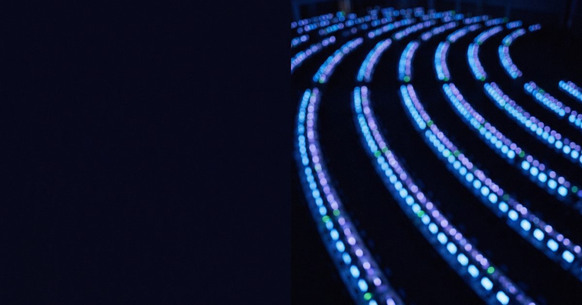 A call center operations floor seen from above at night